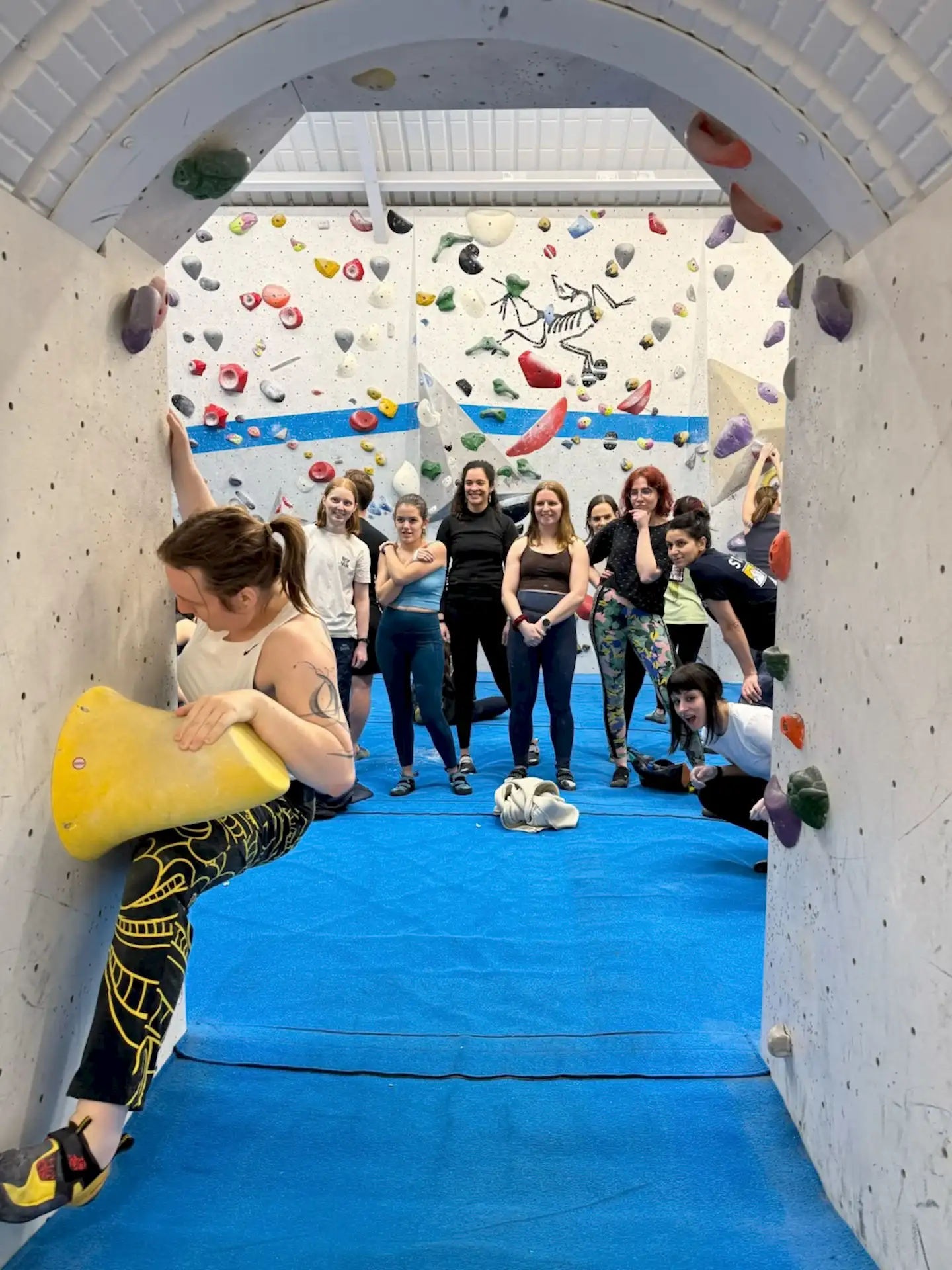 Womens+ social group tat vauxwest, group together watching someone climb 